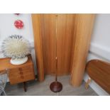 An oak, mahogany and brass standard lamp,