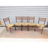 Five teak chairs with rush seating made in Italy for Rooksmoor Mills,