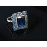 A sapphire and diamond deco ring the central sapphire 10mm x 8mm framed by 14 brilliant cut