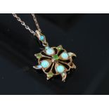 A gold opal and green stone set pendant (one green stone missing) hung on chain stamped 9ct, 3.