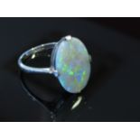 An 18ct white gold platinum set oval opal ring. Size L, 2.