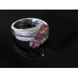 An 18ct white gold diamond and pink sapphire ring, size M, 7.