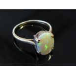 A gold opal ring stamped 18ct, size S, 3.