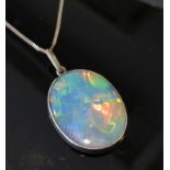 An oval opal pendant, 25mm x20mm,