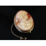 A gold surround cameo brooch with side portrait of lady,