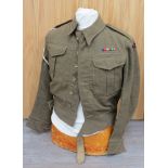 A 1940 pattern battledress blouse with RA titles and cross keys patches