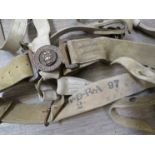 A Victorian Slade Wallace white webbing belt stamped WDRA 97 and RGA, with brass waist belt clasp,