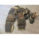 A pair of WWII USAF bomber crew leather flying trousers together with flying boots.