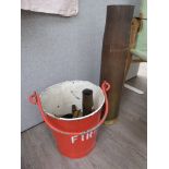 A post-war fire bucket containing mixed brass shells,