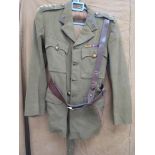 A WWII British Army service dress jacket with Signals insignia, with Sam Browne and webbing belt,