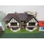 A large Tudor style dolls house for restoration