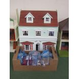 A dolls house and a quantity of "Penny Lodge" furniture