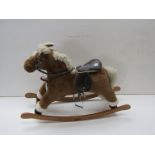 A Mamas and Papas rocking horse on bowed rocker