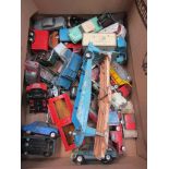 A collection of played with Corgi diecast vehicles including car transporter