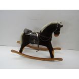 A Mamas and Papas rocking horse on bowed rocker