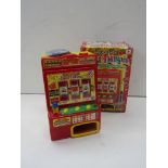 A boxed "Super Slot Triple Thunder" one armed bandit toy