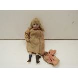 A bisque head girl doll (a/f), neck stamped CH,