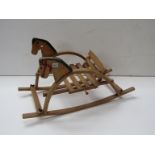 A child's rocking seat with horse design a/f