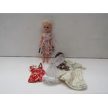 A Rosebud doll and selection of clothing