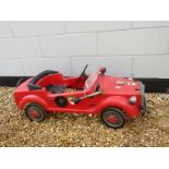 An MG pedal car in red