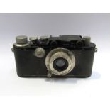 A Leica III rangefinder camera circa 1933, black, serial number 112674, with Leica Elmar 50mm 1:3.