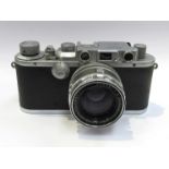 A Leica IIIa rangefinder camera circa 1938, chrome, serial number 303952,