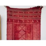 A nomadic reibal flat-weave wool rug/wall hanging with natural red dye,