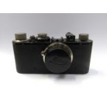 A Leica I rangefinder camera circa 1931, black, serial number 71134, with Leitz Elmar 50mm 1:3.
