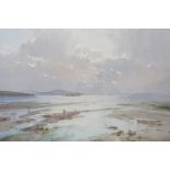 ASHTON CANNELL (1927-1994): A watercolour of coastal islands, figures and dog playing at low tide,