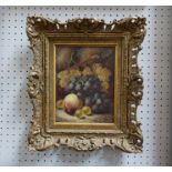 OLIVER CLARE (1853-1927): A gilt framed oil on board still life with grapes, peach and gooseberries.