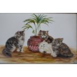 BESSIE BAMBER (fl 1900-1910) An oil on white ceramic panel of four kittens with ptted plant.