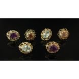 Three pairs of stud earrings set with coloured stones