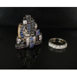 An Art Deco blue and white sapphire and paste dress clip and a 9ct gold dress ring