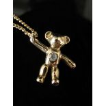 A 9ct gold chain with teddy bear pendant set with diamond, 3.