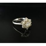 A white gold diamond daisy ring. Size L, 3.