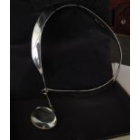 A Georg Jensen silver torq style necklace with large rock crystal droplet,