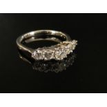 An 18ct white gold five stone diamond ring, 1.