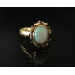 A 9ct gold opal set ring in modernistic mount. Size L, 2.