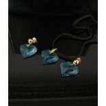 A Lalique blue glass heart shaped pendant with a pair of matching earrings