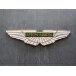 An enamelled "Aston Martin" badge