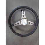 A leather bound and stainlessteel Cortina steering wheel