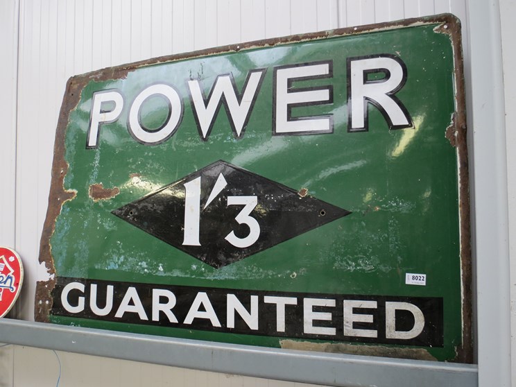 An enamel sign power guaranteed