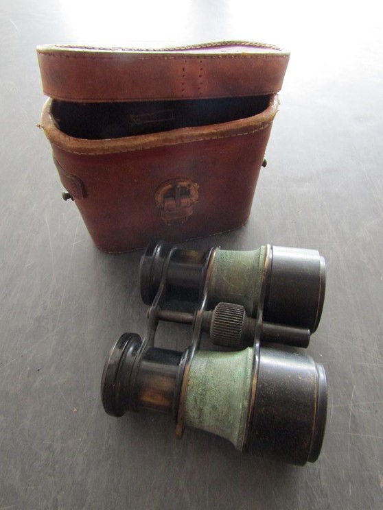 A pair of early Le Chauffeur drivers binoculars in leather case