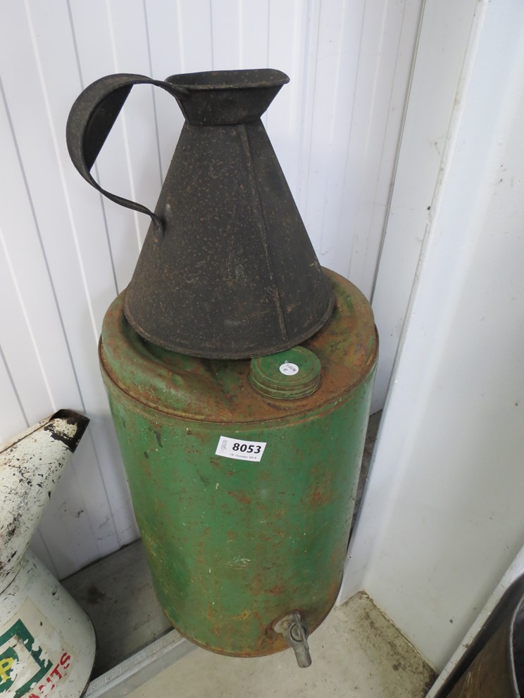 A five gallon paraffin dispenser and quart fuel pourer jug