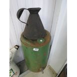 A five gallon paraffin dispenser and quart fuel pourer jug