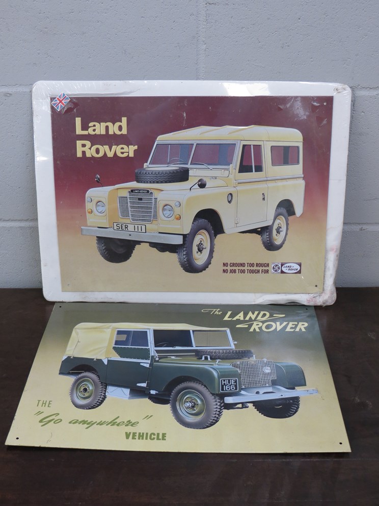 Two modern tin Land Rover signs