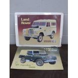 Two modern tin Land Rover signs