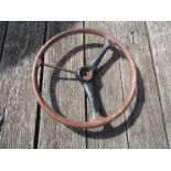 A vintage leather bound metal steering wheel A/F