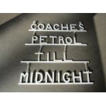 A wrought metal petrol station sign "Coaches Petrol TILL Midnight" some re welding to hangers