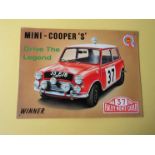 Two Mini Cooper tin signs